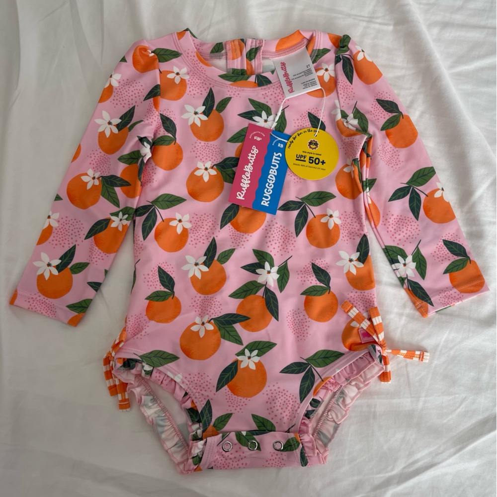 Ruffle Butts Pink Long Sleeve Rash Guard with Orange Print UPF 50+ size 2T